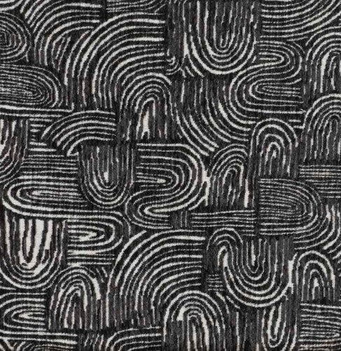 Black and white abstract patterned fabric with organic wavy lines and textured woven appearance.